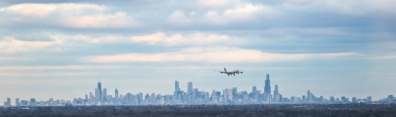 Chicago: Airplane Flying over City