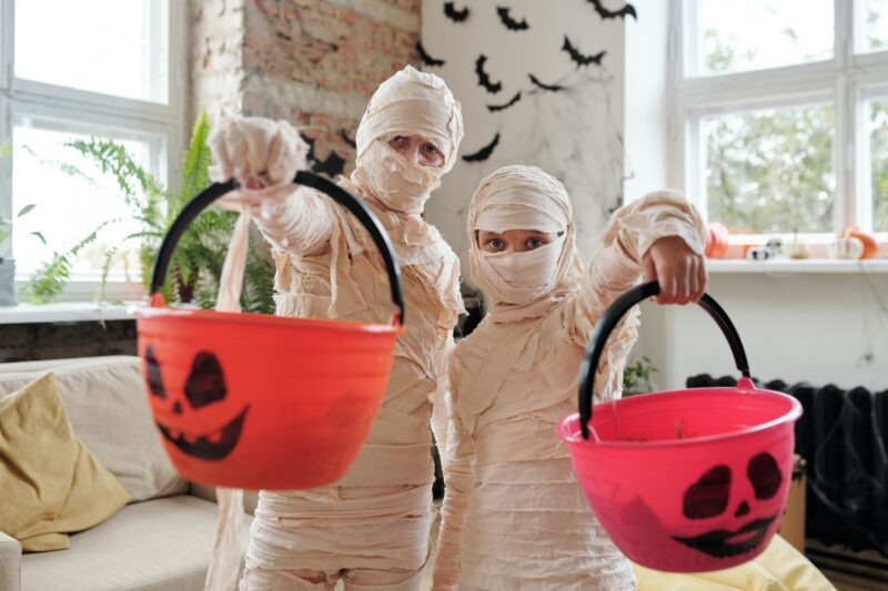 Mummys holding Halloween Treat Buckets