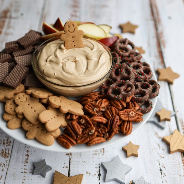 Gingerbread Dip in a bowl with cookies, nuts and pretzels