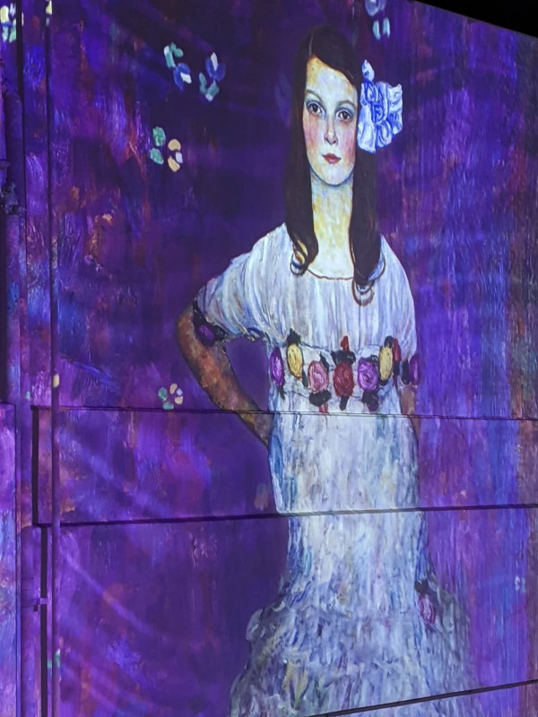 Immersive Klimt: Painting of Girl Against a Blue Background