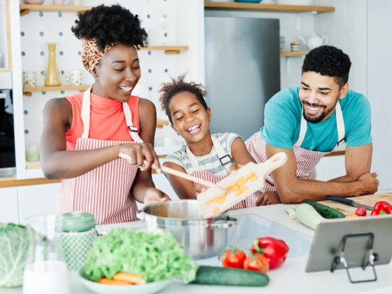 Mother, Father and Child cooking together