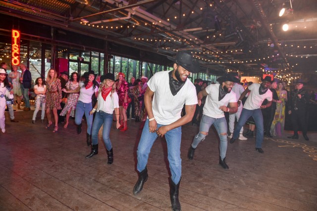 Scrubs in the City: Guests Line Dancing