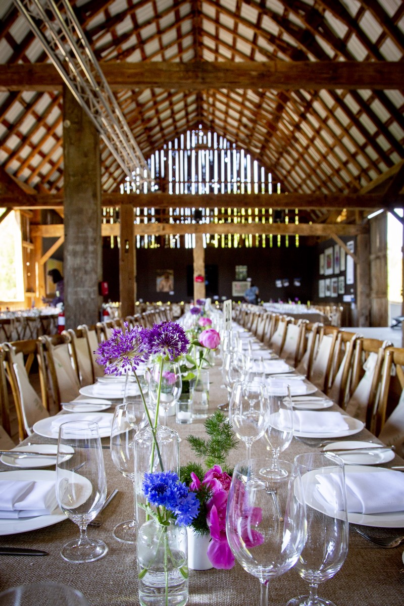 Long table in hayloft with flowers