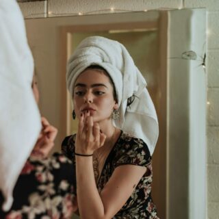 Health and Beauty: Woman applying makeup