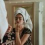 Health and Beauty: Woman applying makeup