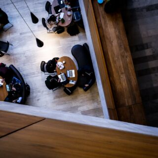 Post-Secondary Education: Students working at tables in the study hall