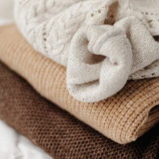 Dress Comfortably For Work: Stack of women's sweaters