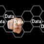 Data Room: Image with man pointing at virtual data honey combs