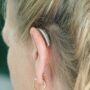 Hearing Loss: woman with a hearing aid