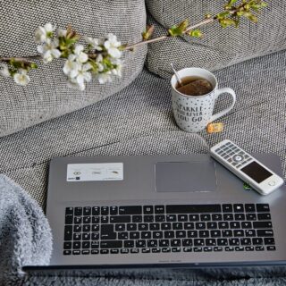 Working Remotely: Laptop and coffee cup on a couch