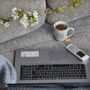 Working Remotely: Laptop and coffee cup on a couch