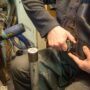 Best Shoe repair services in Greater Vancouver: Cobbler fixing a woman's boot