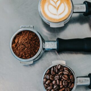Espresso Machine: coffee beans, grounds and a latte