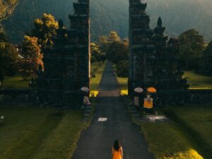 Bali: Back View of a Woman Walking Towards the Famous Bali Handara Gate