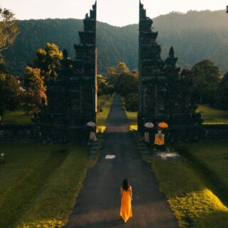 Bali: Back View of a Woman Walking Towards the Famous Bali Handara Gate