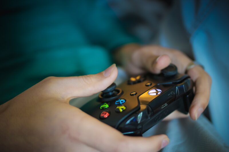 Gaming Industry: Console in a woman's hands