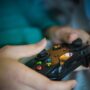 Gaming Industry: Console in a woman's hands