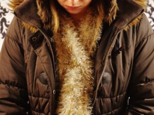 Jacket Material: woman in a brown polyester jacket