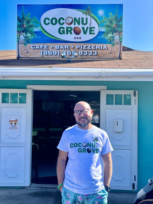 Best Restaurants in St. Kitts: Coconut Grove Restaurant with owner Julian Armstrong in front