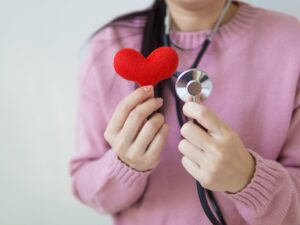 Health Check Ups: Doctor holding stuffed Heart