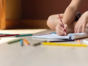 Early Childhood Stimulation: Child colouring with colour pencils