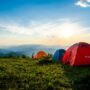 The Great Outdoors: Tents on a pasture overlooking a mountain