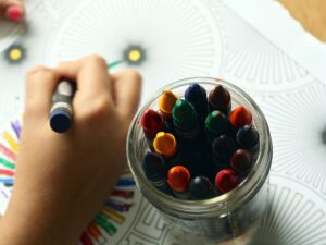 Daycare: Child Colouring with crayons