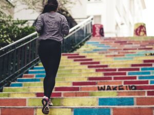 Physical Changes: Woman running up a set of stairs