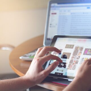 Getting Started in Tech: Woman on an ipad with laptop in the background