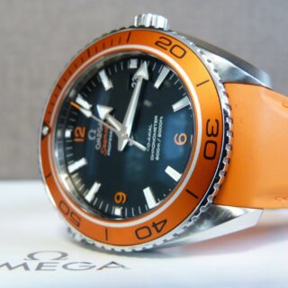 Luxury Watches: Omega Watch lying on its ide