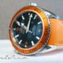 Luxury Watches: Omega Watch lying on its ide