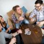 Card Games: People around a table playing cards
