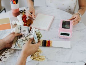 Investment: Couple at a table with a calculator counting money