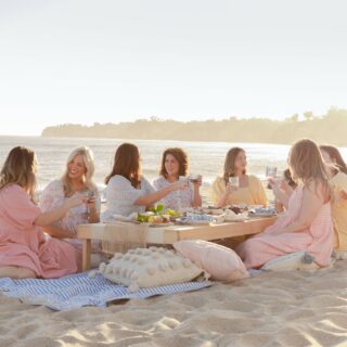 Jillian Harris: Jillian Harris sitting around a low table at the beach with 6 women