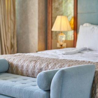 Luxury Bedspread: Bed with bench at the foot of it