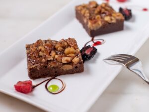 Palmer House Brownie: Two brownies on a long, rectangular plate