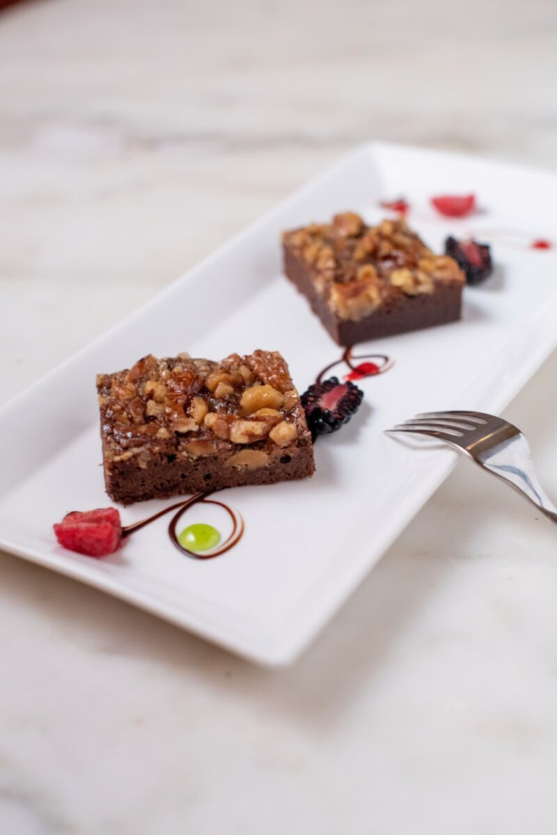 Palmer House Brownie: Two brownies on a long, rectangular plate