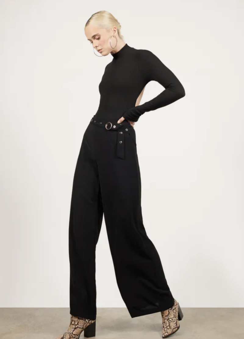 Spring Fashion Trends: Woman in turtleneck and wide legged pants