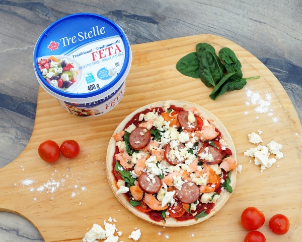 Lunch: Tre Stelle Feta on a wooden board next to a pizza