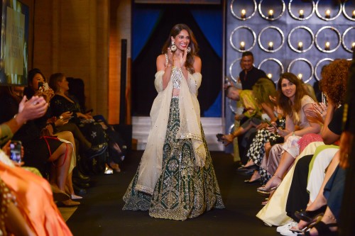 Grandest Night of Fashion: Sangita Patel clapping her hands on the catwalk