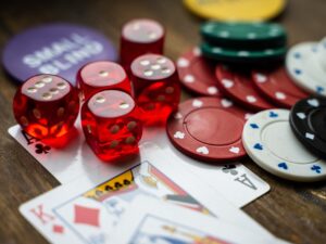 Card Loving Celebrities: Poker Chips and cards strewn on table