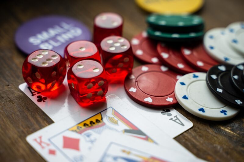 Card Loving Celebrities: Poker Chips and cards strewn on table