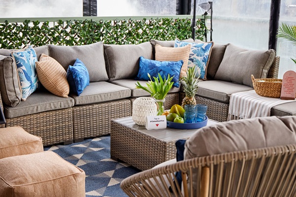 Patio Furniture: Summer Palm seat featuring sectional with cushions, table and two poufs