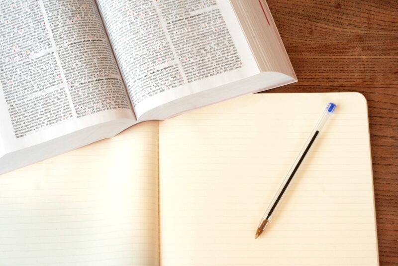 online gambling: law book and notepad with pen