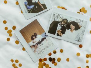 Wedding Photography: Polaroids of a bride and groom set against a white background with gold confetti