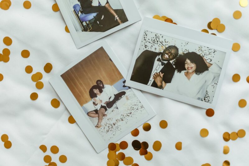 Wedding Photography: Polaroids of a bride and groom set against a white background with gold confetti