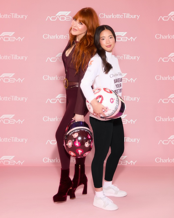 F1 Academy: Charlotte Tilbury and Chloe Chong in front a step and repeat