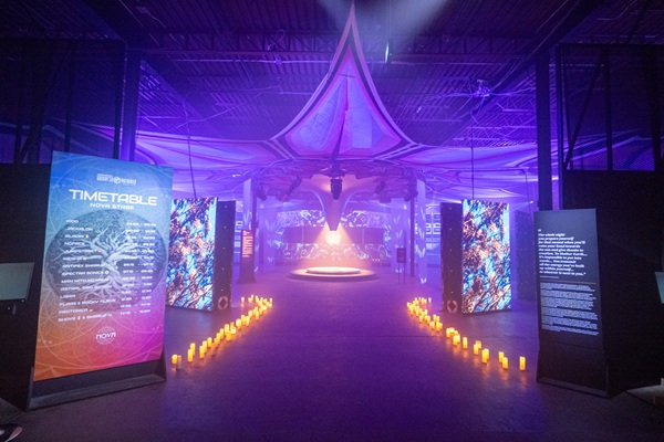 Nova Music Festival Exhibition: timeline and entry into an area of the exhibit lined with electric candles