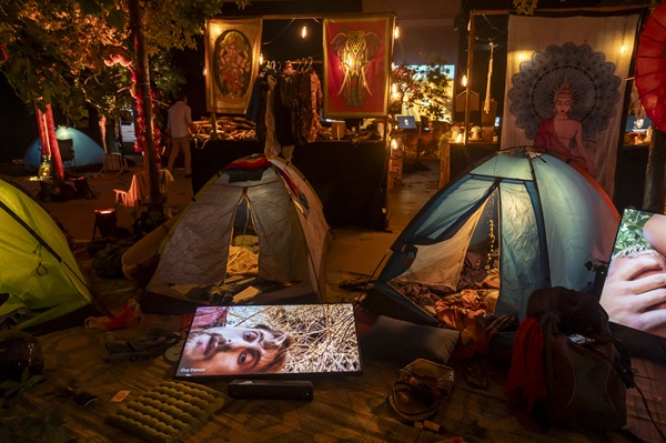Nova Music Festival Exhibition: Area with tents, artwork and a screen