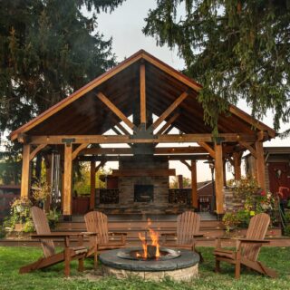 Wood Staining: Wooden patio with Muskoka Chairs around a fire pit